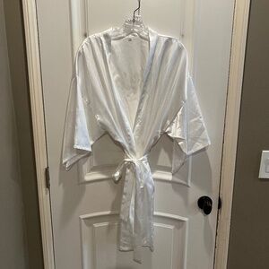 Silky white robe with "Bride" written on the back